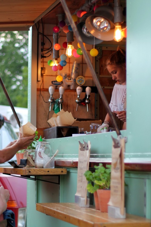 food truck employee serving a customer